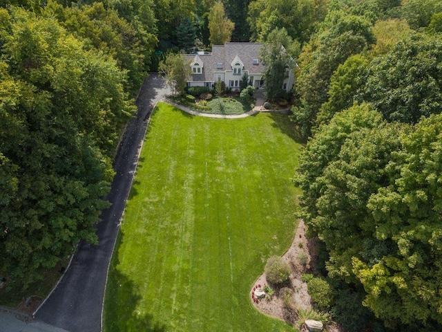 drone / aerial view featuring a forest view