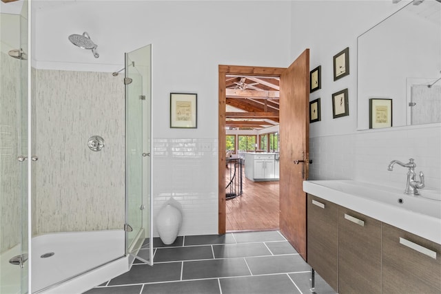 65 Deuner Hill Rd, Callicoon Center, NY 12723 - bathroom with tile patterned floors, a stall shower, tile walls, and vanity