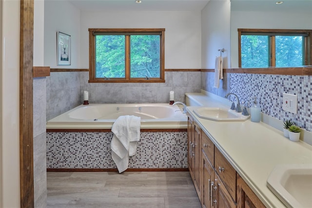 65 Deuner Hill Rd, Callicoon Center, NY 12723 - full bath featuring vanity, wood finished floors, a garden tub, and wainscoting