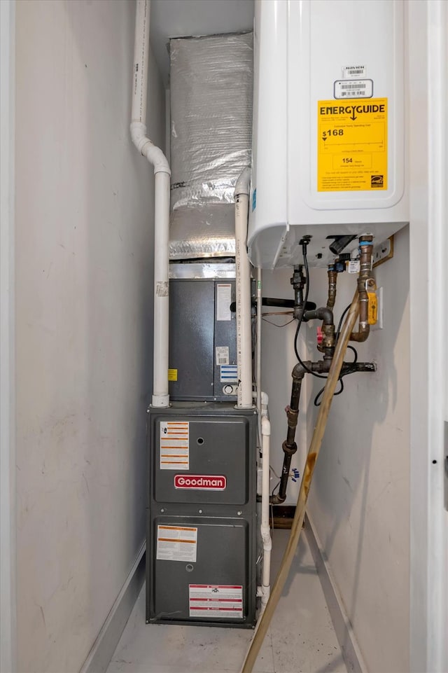 utility room with tankless water heater