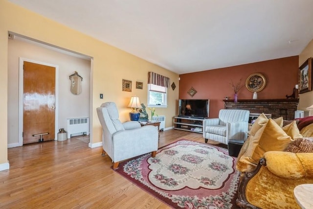 260 Washington Ave, Harbor Isle, NY 11558 - living room featuring radiator, light wood-style floors, and baseboards