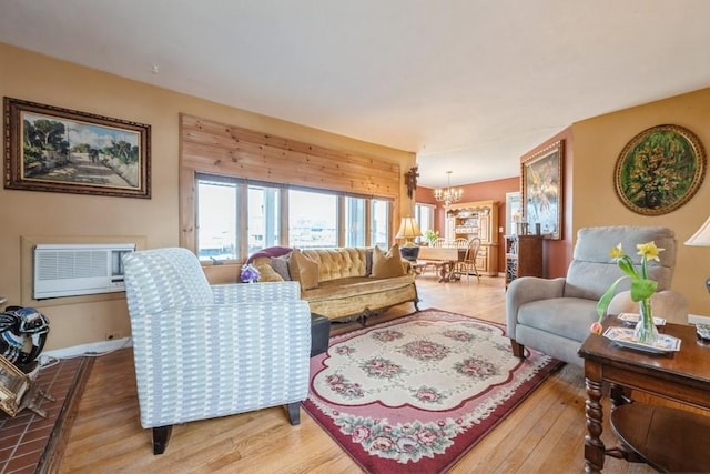 260 Washington Ave, Harbor Isle, NY 11558 - living room featuring wood finished floors and an inviting chandelier