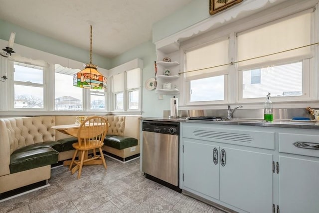 260 Washington Ave, Harbor Isle, NY 11558 - kitchen with stainless steel dishwasher, open shelves, a wealth of natural light, and light floors