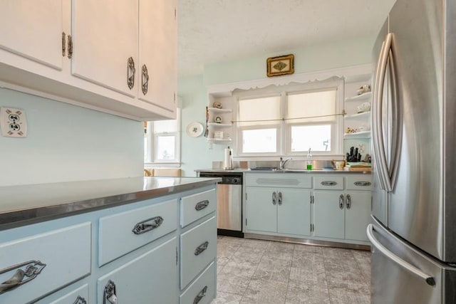 260 Washington Ave, Harbor Isle, NY 11558 - kitchen featuring a sink, open shelves, appliances with stainless steel finishes, and plenty of natural light