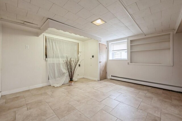 260 Washington Ave, Harbor Isle, NY 11558 - empty room featuring a baseboard heating unit and baseboards