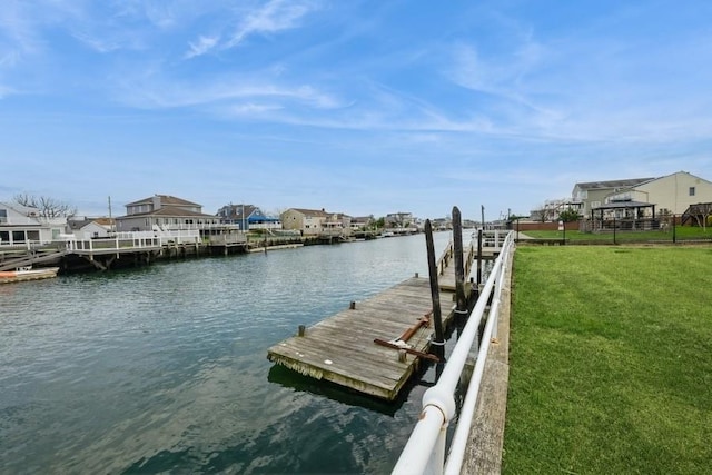260 Washington Ave, Harbor Isle, NY 11558 - view of dock with a residential view, a water view, and a lawn