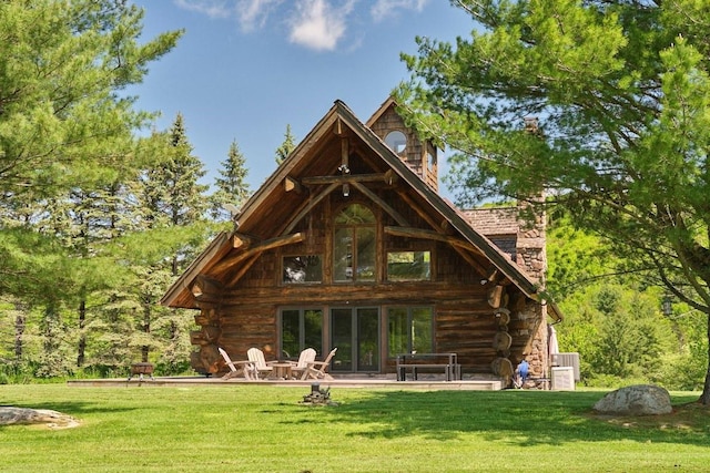 649 County Road 95, North Branch, NY 12766 - back of house with log exterior and a lawn