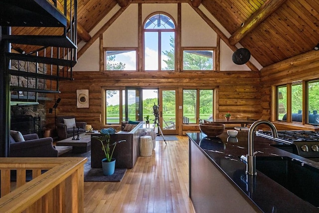 649 County Road 95, North Branch, NY 12766 - living room with rustic walls, high vaulted ceiling, light wood finished floors, and a wood ceiling with exposed beams
