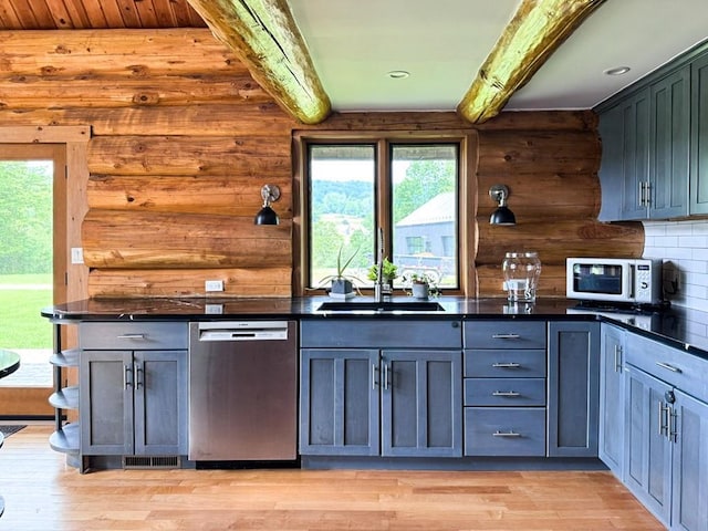 649 County Road 95, North Branch, NY 12766 - kitchen with dishwasher, beam ceiling, dark countertops, light wood-style flooring, and white microwave