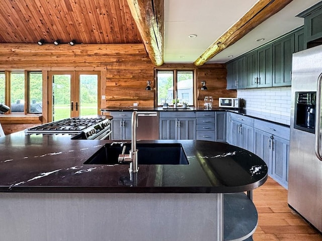 649 County Road 95, North Branch, NY 12766 - kitchen with appliances with stainless steel finishes, light wood-style floors, french doors, backsplash, and beamed ceiling