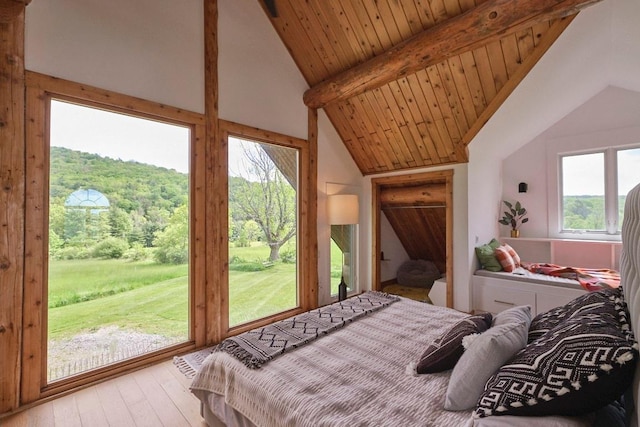 649 County Road 95, North Branch, NY 12766 - bedroom with access to exterior, wood-type flooring, and a wooded view