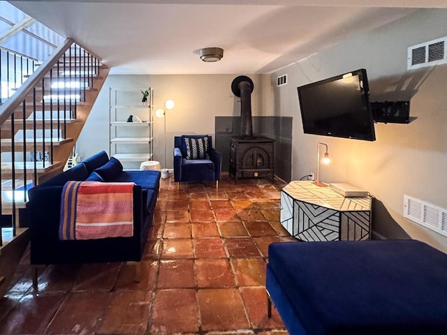 649 County Road 95, North Branch, NY 12766 - living area with stairs and a wood stove