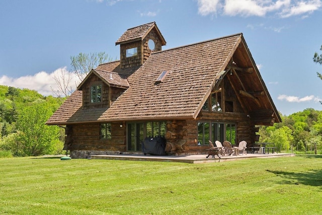 649 County Road 95, North Branch, NY 12766 - back of property with a lawn and a patio area