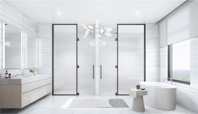 570 Bedford Rd Unit 6-1C, Armonk, NY 10504 - full bath featuring tile walls, a freestanding bath, vanity, and tile patterned floors