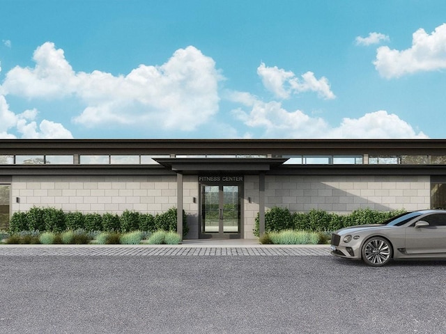 570 Bedford Rd Unit 6-1C, Armonk, NY 10504 - view of exterior entry featuring french doors and concrete block siding