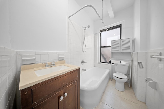 1001 Anderson Ave Unit 22, Bronx, NY 10452 - full bathroom featuring tile walls, washtub / shower combination, vanity, wainscoting, and tile patterned flooring