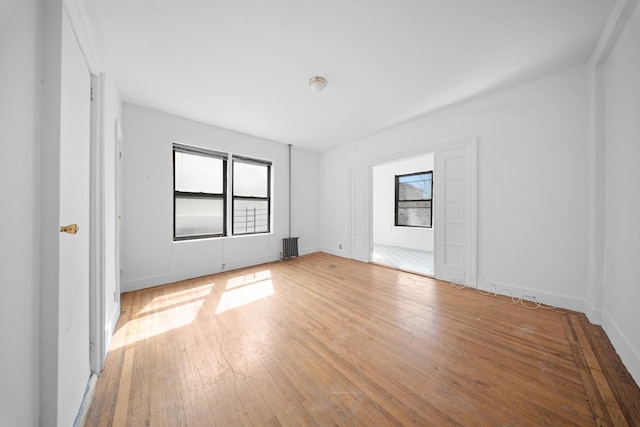 1001 Anderson Ave Unit 22, Bronx, NY 10452 - empty room with hardwood / wood-style floors and radiator heating unit
