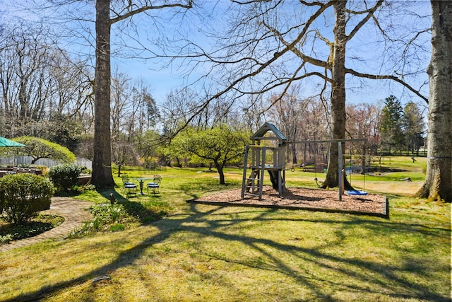 communal playground featuring a yard