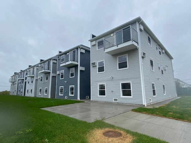 rear view of property featuring a yard