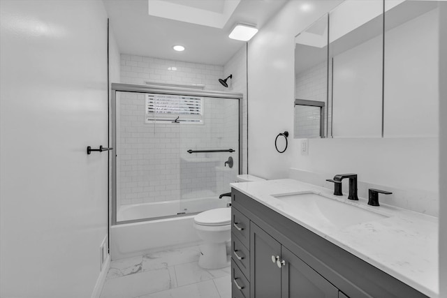 full bathroom with marble finish floor, toilet, shower / bath combination with glass door, and vanity