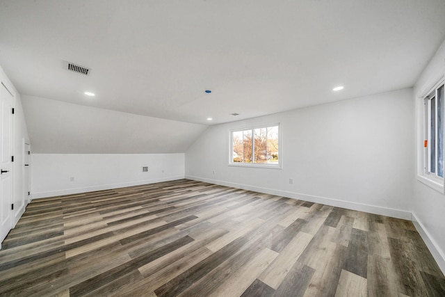 bonus room with lofted ceiling, recessed lighting, baseboards, visible vents, and wood finished floors