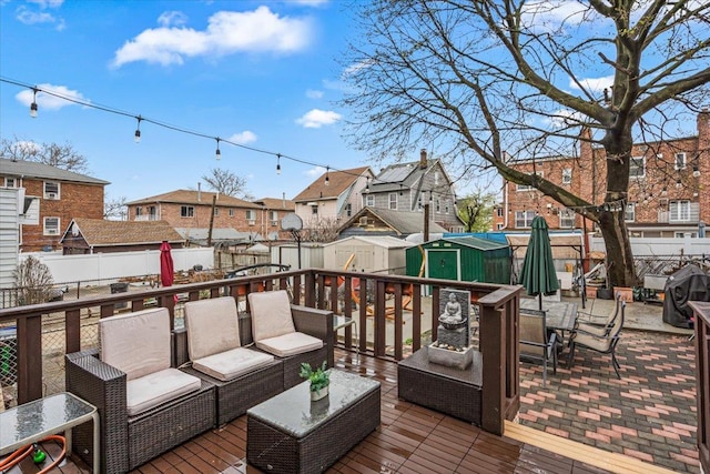 61-27 160th St, Fresh Meadows, NY 11365 - deck featuring a residential view, outdoor lounge area, a fenced backyard, an outbuilding, and a storage unit