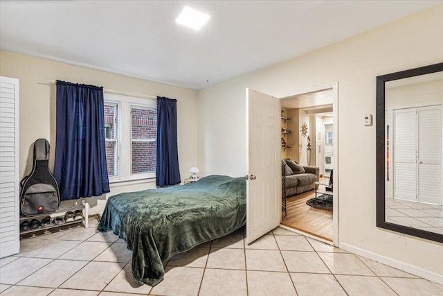 61-27 160th St, Fresh Meadows, NY 11365 - bedroom with light tile patterned flooring and baseboards