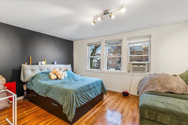 61-27 160th St, Fresh Meadows, NY 11365 - bedroom with baseboards and hardwood / wood-style flooring
