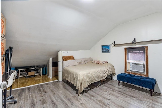 61-27 160th St, Fresh Meadows, NY 11365 - bedroom featuring cooling unit, vaulted ceiling, and wood finished floors
