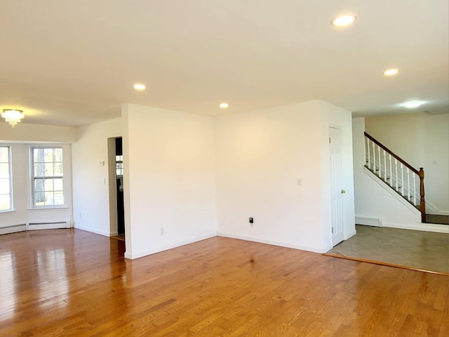 89 Railroad Ave, Center Moriches, NY 11934 - empty room with stairs, wood finished floors, and recessed lighting