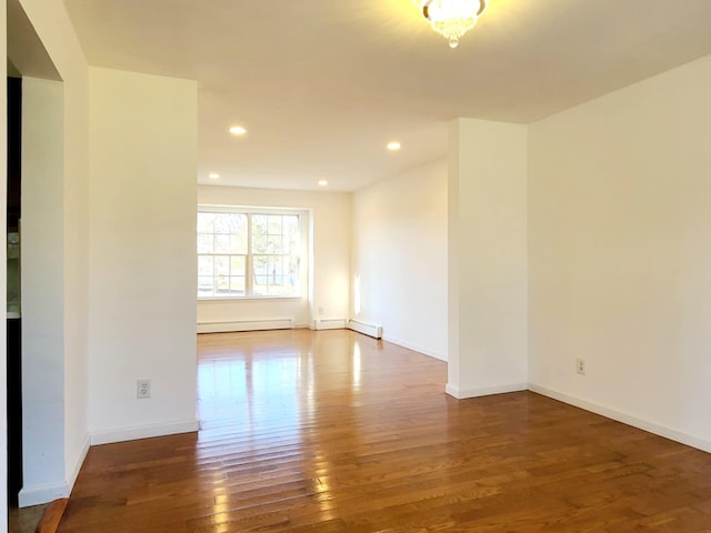 89 Railroad Ave, Center Moriches, NY 11934 - empty room featuring a baseboard radiator, recessed lighting, baseboards, and hardwood / wood-style floors