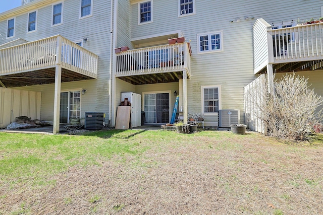 back of property featuring a yard and cooling unit