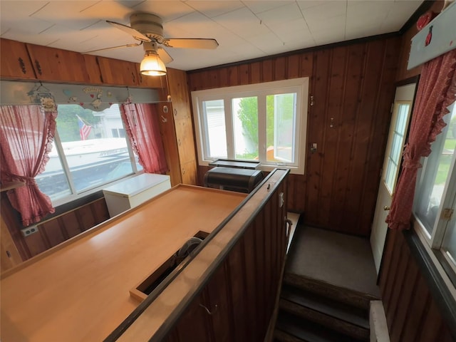 524 Polaris St, North Babylon, NY 11703 - stairs with wooden walls and ceiling fan