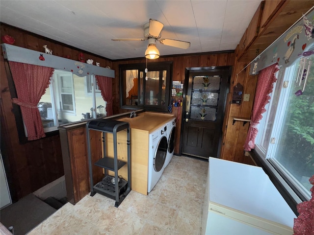 524 Polaris St, North Babylon, NY 11703 - washroom featuring healthy amount of natural light, wood walls, washing machine and dryer, and ceiling fan