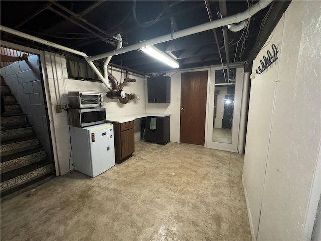 524 Polaris St, North Babylon, NY 11703 - unfinished below grade area with fridge and stairway