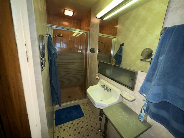 524 Polaris St, North Babylon, NY 11703 - bathroom with a sink, a shower stall, and tile patterned floors