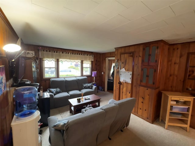 524 Polaris St, North Babylon, NY 11703 - living area featuring carpet and wood walls
