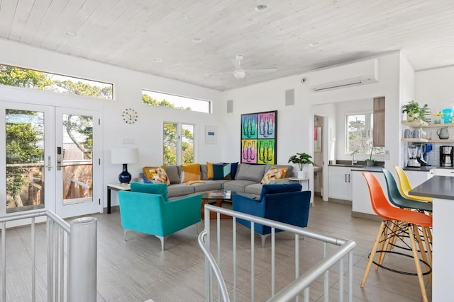 267 Floral Walk, Fire Island Pines, NY 11782 - living room with plenty of natural light, ceiling fan, an AC wall unit, and wood ceiling