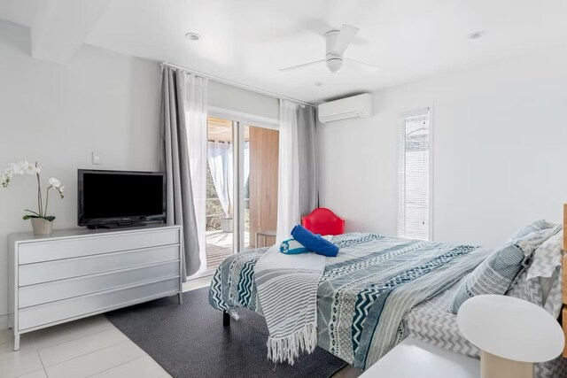 267 Floral Walk, Fire Island Pines, NY 11782 - bedroom featuring beam ceiling, an AC wall unit, and a ceiling fan