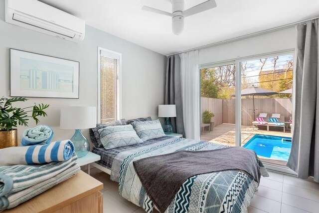 267 Floral Walk, Fire Island Pines, NY 11782 - bedroom featuring ceiling fan, access to outside, an AC wall unit, and light tile patterned floors