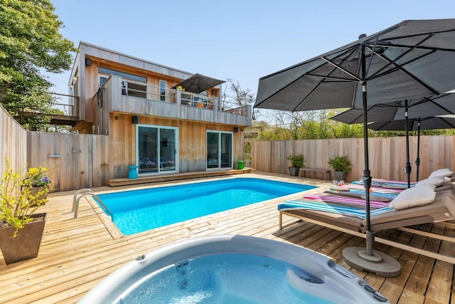 267 Floral Walk, Fire Island Pines, NY 11782 - view of swimming pool featuring a fenced backyard, a deck, and hot tub deck surround