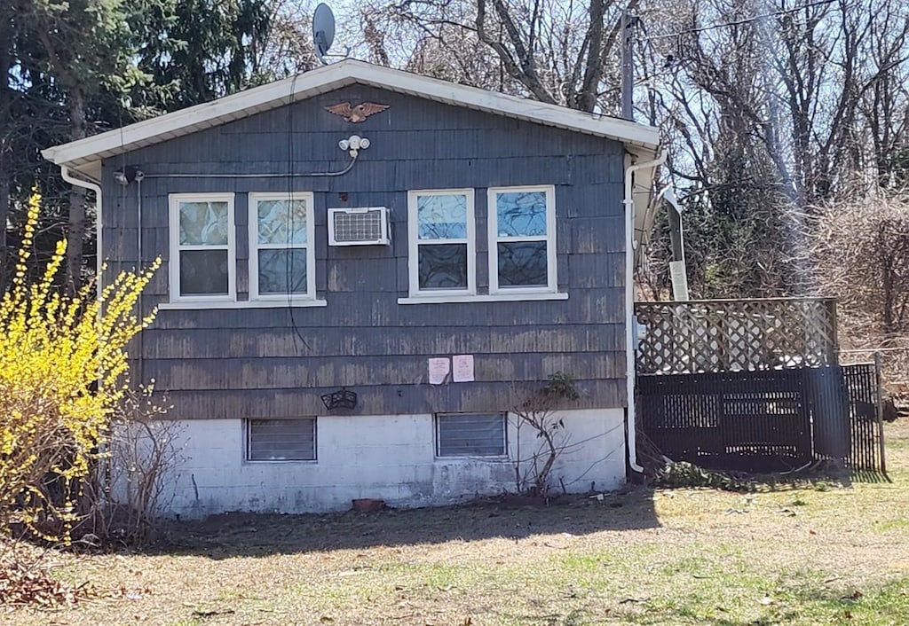 44 Osage St, Selden, NY 11784 - view of side of property featuring a lawn