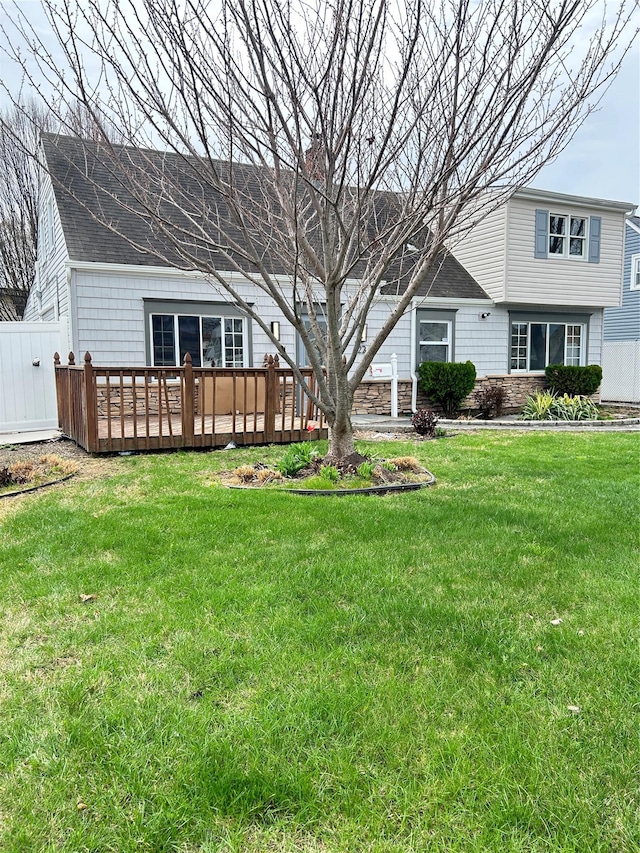 22 Peacock Ln, Levittown, NY 11756 - exterior space with a lawn, a wooden deck, and fence