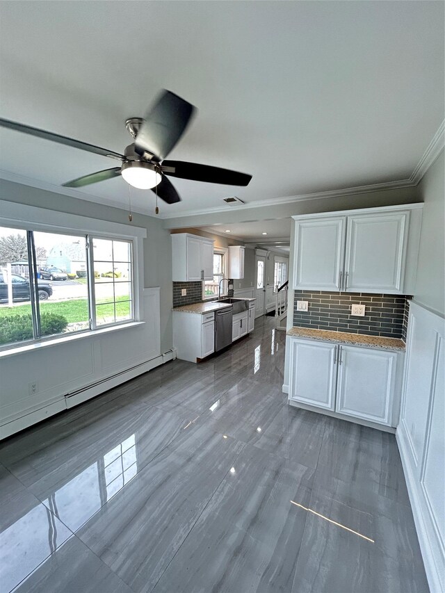 22 Peacock Ln, Levittown, NY 11756 - kitchen with crown molding, a ceiling fan, tasteful backsplash, white cabinetry, and a baseboard heating unit