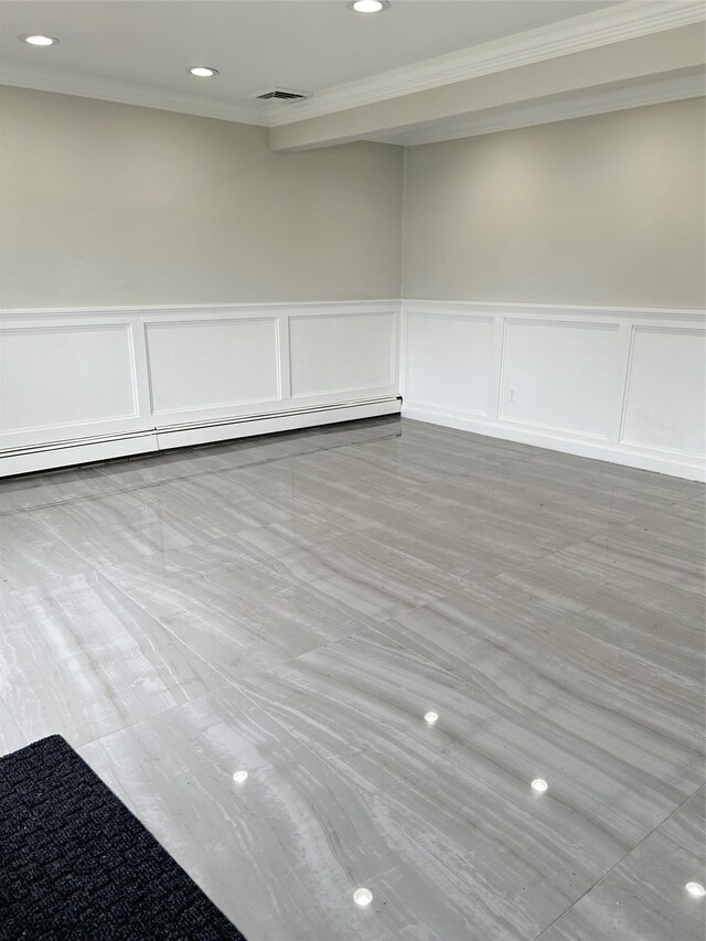 22 Peacock Ln, Levittown, NY 11756 - empty room featuring crown molding, baseboard heating, a decorative wall, visible vents, and recessed lighting