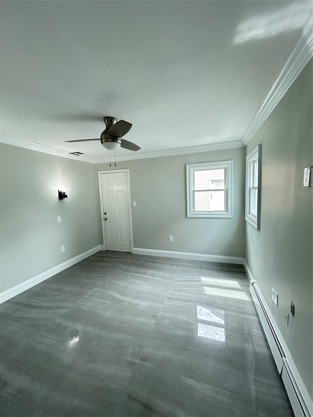 22 Peacock Ln, Levittown, NY 11756 - spare room with a ceiling fan, ornamental molding, baseboards, and a baseboard heating unit