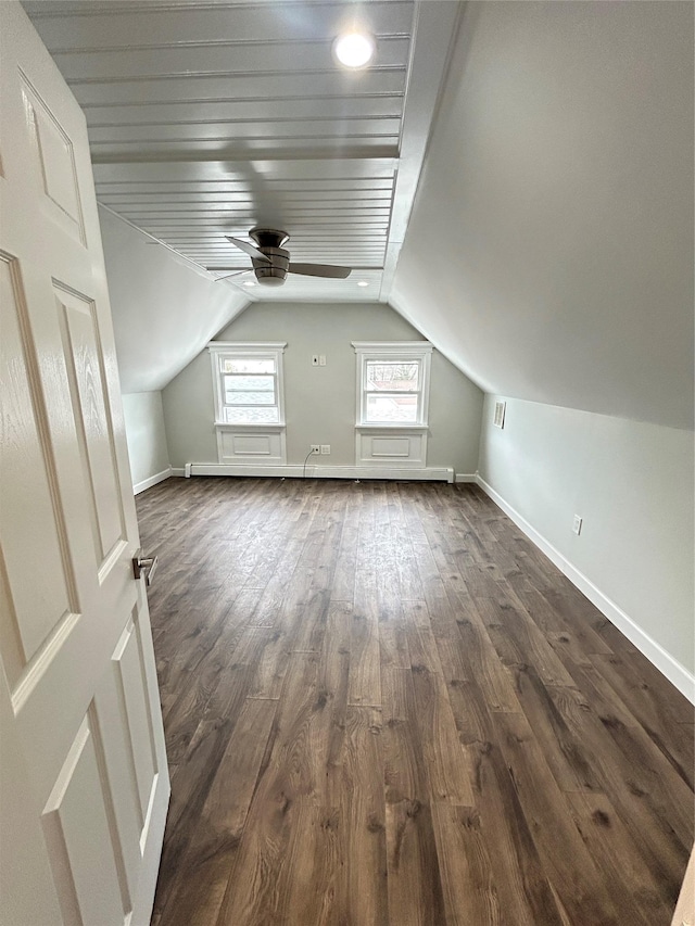 22 Peacock Ln, Levittown, NY 11756 - additional living space featuring dark wood-style flooring, baseboards, vaulted ceiling, and ceiling fan