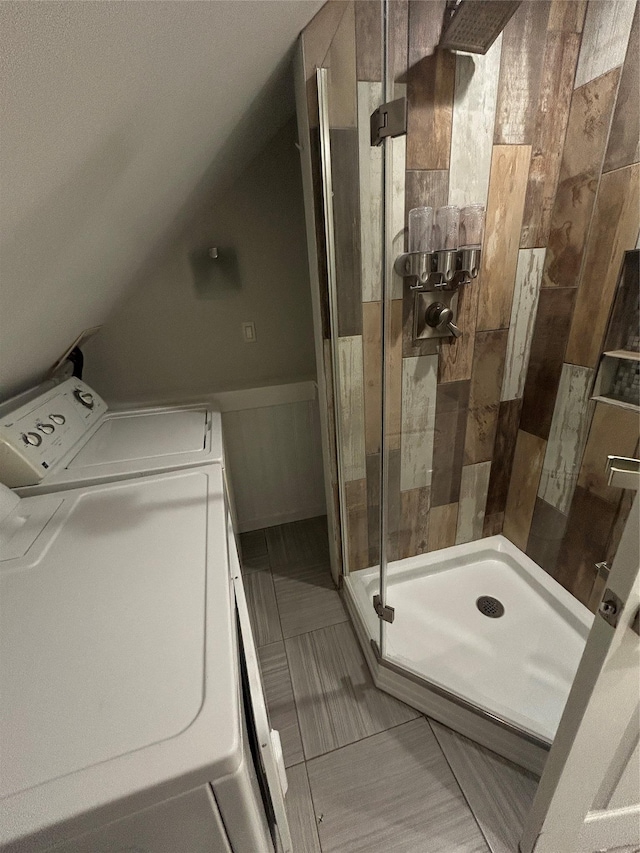 22 Peacock Ln, Levittown, NY 11756 - full bathroom featuring a stall shower, vaulted ceiling, and washer / clothes dryer