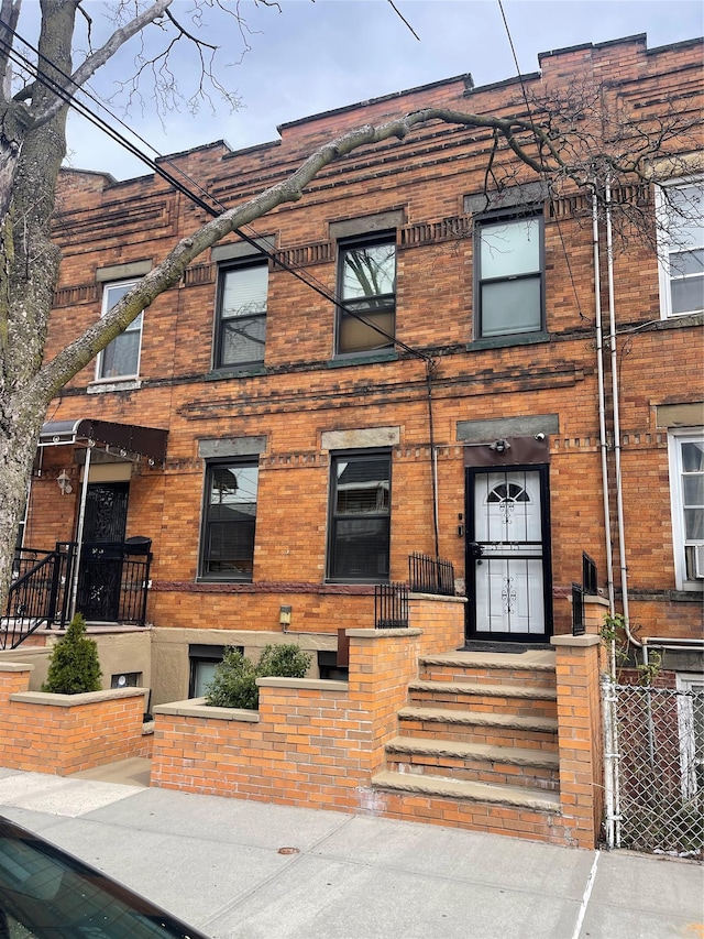 view of front of property featuring brick siding