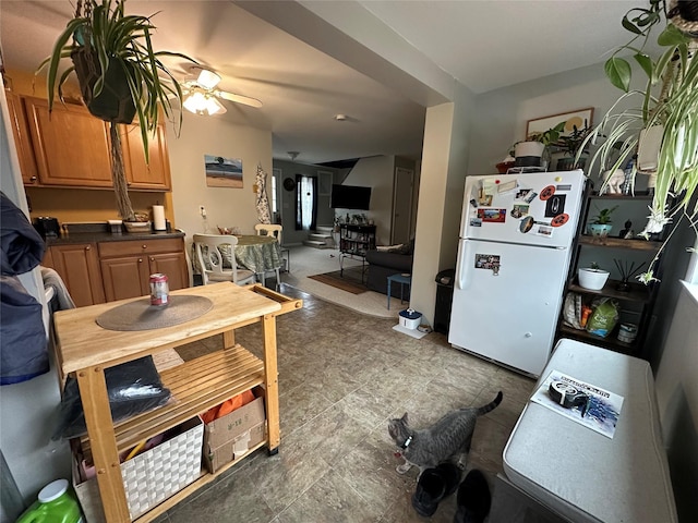 dining space featuring ceiling fan